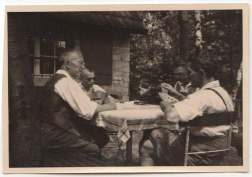 guys-playing-cards-table-outside-cabin-woods-old-vintage-photo-snapshot-r7657-9d63cbad06e8b691b4c578e3cb8ee5e4